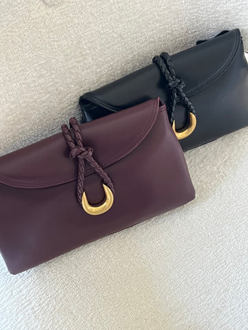 Small leather envelope bag with braid closure