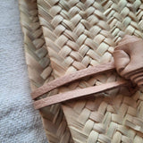 Moroccan straw clutch with leather