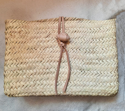 Moroccan straw clutch with leather
