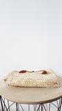 Moroccan straw clutch with leather