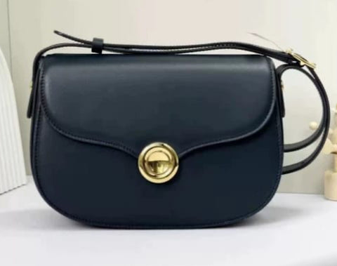 Leather handbag gold circle closure