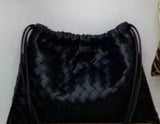 Leather woven cinch bag