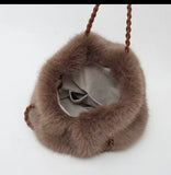 Faux fur tote with braided straps