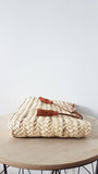 Moroccan straw clutch with leather