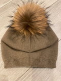 Hat with removable fur pom